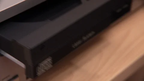 Close-up of hand placing CD inside CD player Stock Footage 89961846