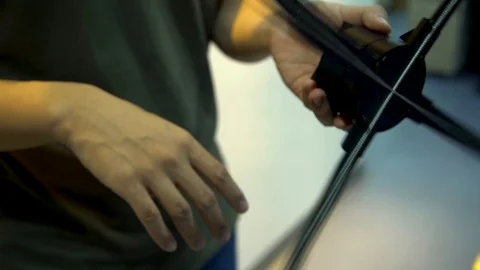 A close up of a hand playing around with one of the blades of a small Stock Footage 96225541
