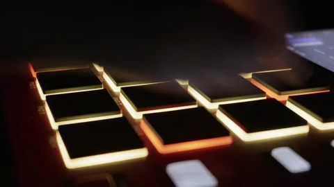 Close Up Hand Playing Beats On Illuminated Drum Machine Stock Footage 327715180