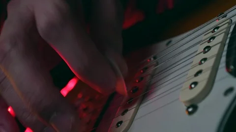 Close up of Hand Playing Beautiful Electric Guitar Stock Footage 124086884