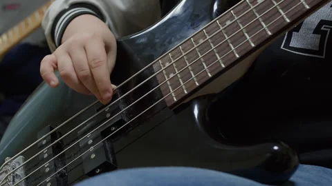 Close-up of Hand Playing Electric Bass Guitar Video stock 330095448