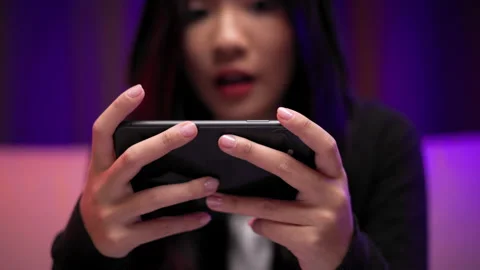 Close-up hand playing games on cellphone winning victory moment. Stock Footage 175633515