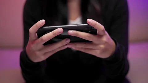 Close-up hand playing games on cellphone winning victory moment. Stock Footage 175634988