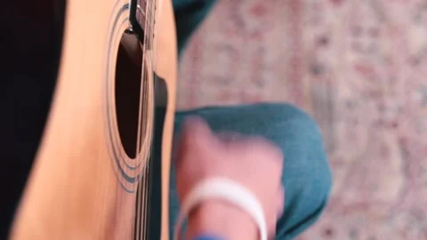 Close-up hand playing guitar. Make sounds on string instrument in music lesson 動画素材 141089298