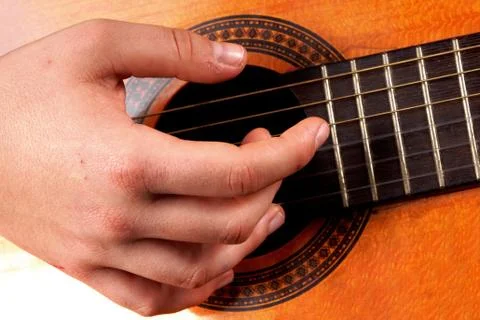 Close up of an hand playing guitar Stock Photos