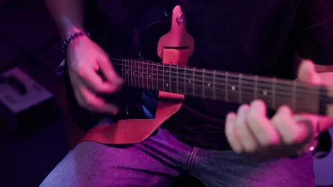 Close up hand playing guitar. Young musician playing guitar Stock Footage 166092626