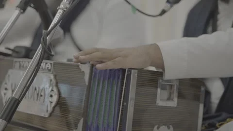 Close-up of a hand playing an harmonium during a musical performance.mp4 Stock-Footage 316301622