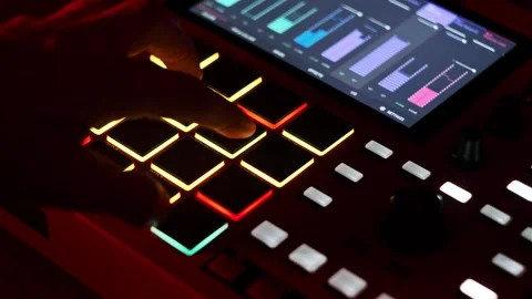 Close-Up of Hand Playing Pads on Digital Beatmaker Stock Footage 312896045
