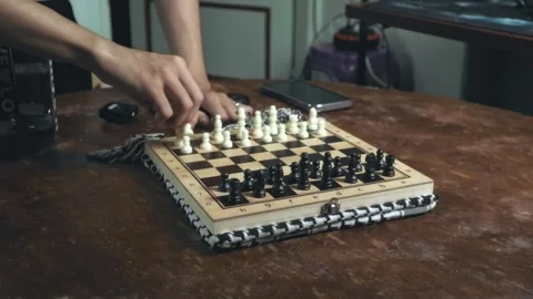Close-Up of Hand Playing Speed Chess on Wooden Board - Strategic Fast Move Stock Footage 321679682
