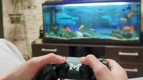 Close-up Hand Playing a Video Game at Home. A Teenager is Resting After School. Stock Footage 236287909