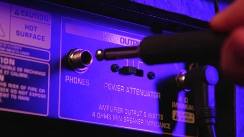 Close up of Hand Plug In and Out Headphone Aux in Amplifier Stock Footage 123858162