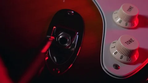 Close up of Hand Plug in the Aux in Guitar Stock Footage 124086523