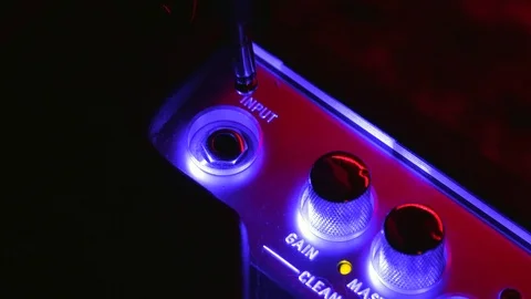 Close up of Hand Plug Out and In Aux Cable in Amplifier Vídeos de archivo 123858445