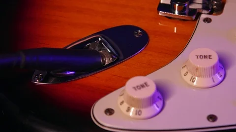 Close up of Hand Plug Out and In Aux in Guitar Vídeo Stock 123858714