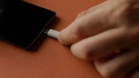 Close Up of Hand Plugging USB-C Cable Into Smartphone Stock-Footage 343450943