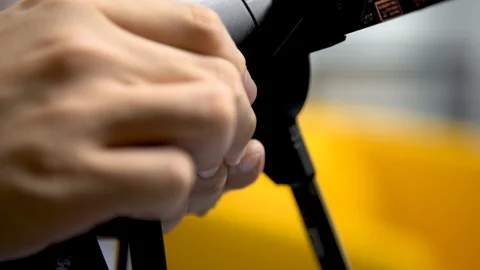 A close up of a hand plugging in a wire into a small hologaphic fan Stock Footage 96226070
