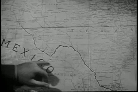 Close-up of hand pointing to Mexico on map Stock Footage 11348407
