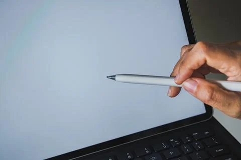 Close-up of Hand Pointing Stylus at Blank Tablet Screen Stock Photos
