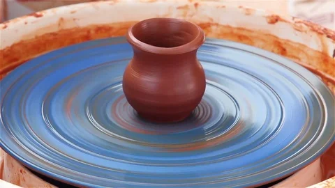 Close-up of the hand of a potter make a cup of clay. Stock Footage