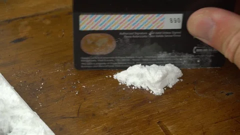 Close up of a Hand Preparing a Cocaine Line Using a Credit Card, in Italy on 4 Stock Footage 91829039