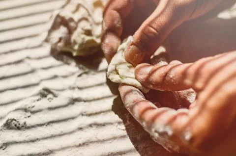 Close up of a hand preparing a dough Stock Photos