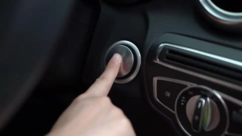 Close up a hand press the button of car engine Stock Footage 289529192