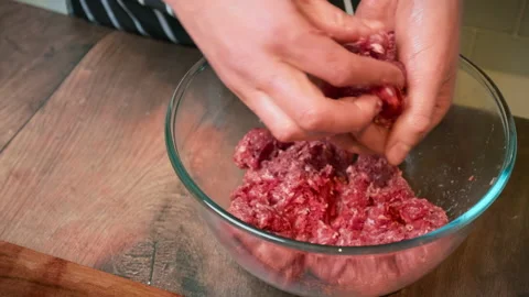 Close-up hand-pressed steak in 4K. Video stock 153728381