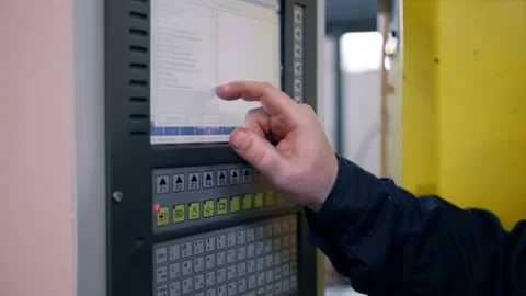 Close-up. The hand presses the buttons on the control panel of the CNC machine Stock Footage 171775128