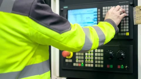 Close-up. The hand presses the buttons on the control panel of the CNC machine Stock Footage 171776230
