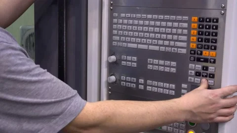 Close-up. The hand presses the buttons on the control panel of the CNC machine Stock Footage 171776591