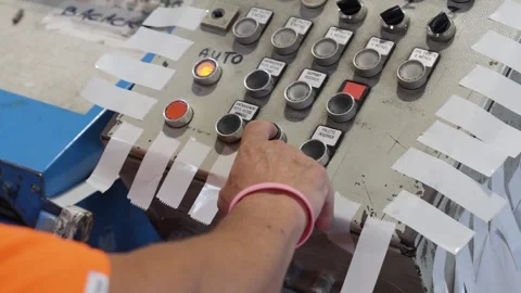 Close-up of a hand pressing a black button on a tablet with several Stock Footage 340876430