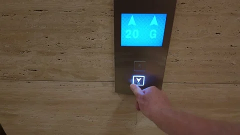 Close-up of Hand Pressing Elevator Button in Modern Skyscraper Stock Footage 321271604