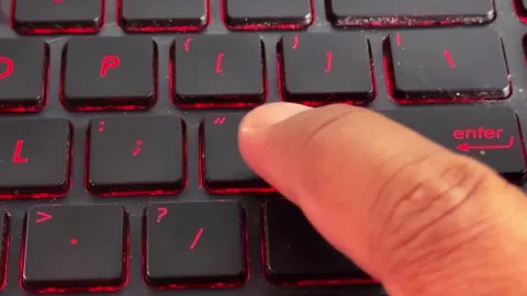 Close-up hand pressing laptop key, typing activity, tech device, Stock Footage 336357239