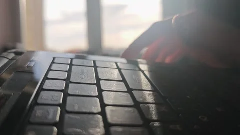 Close-up of hand pressing laptop keyboard keys Stock Footage 336445020
