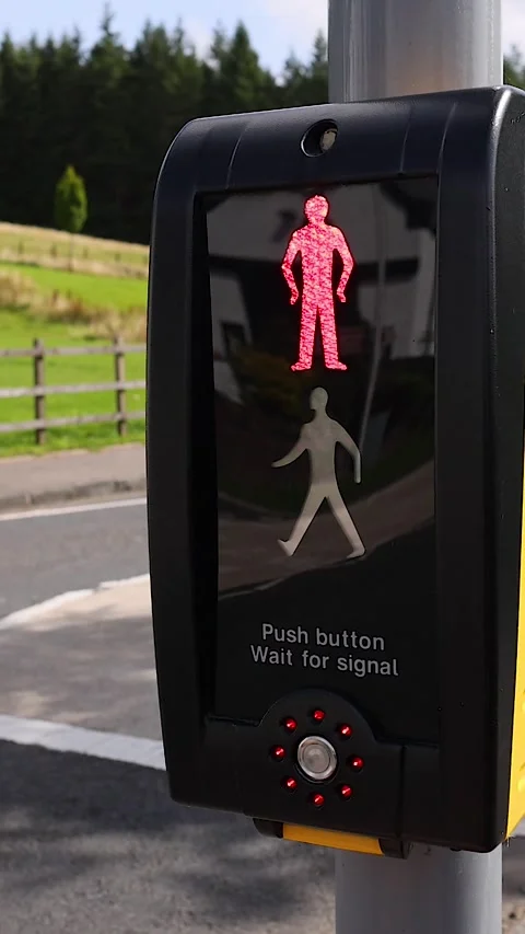 Close Up of Hand Pressing Pedestrian Crossing Button in Countryside Stock Footage 326088655