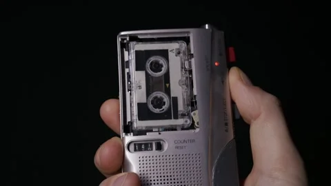 Close Up Hand Pressing Play On Vintage Silver Microcassette Recorder Video stock 327911069