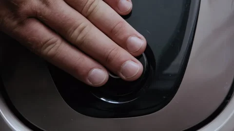 Close-Up Hand Pressing Power Button on Vacuum Cleaner 库存影片 317973525