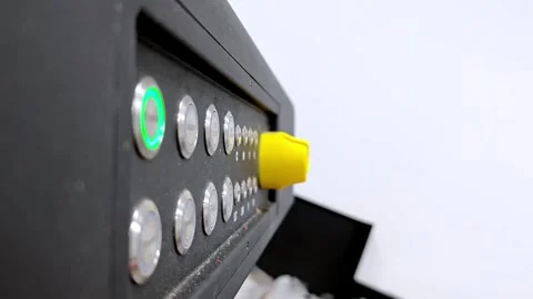 Close-up of a hand pressing power buttons on an industrial control panel Stock Footage 343987405