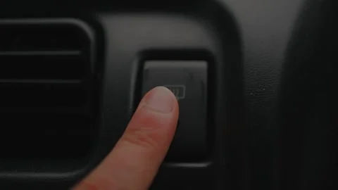 Close-up of a hand pressing the rear window defroster button... 스톡 동영상 339101321
