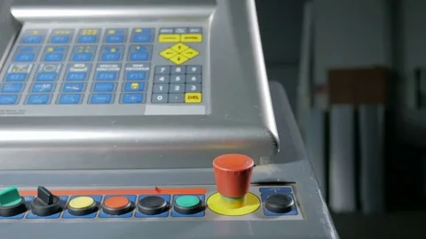 Close-up of hand pressing the red button on the desktop control panel, CNC Stock Footage 71645290