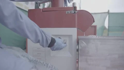 Close-up of hand pressing switch on food processing equipment Stock-Footage 327442418