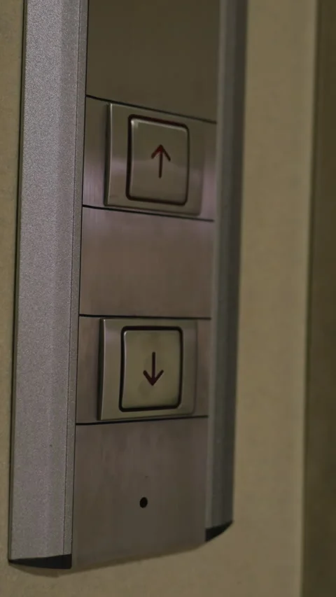 Close-up of Hand Pressing Upward Button on Modern Elevator Panel in Business Stock Footage 318808597