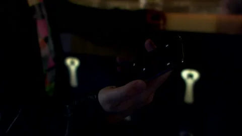 Close Up On Hand Of Professional Man On Mobile Phone in bar Stock Footage 130283803