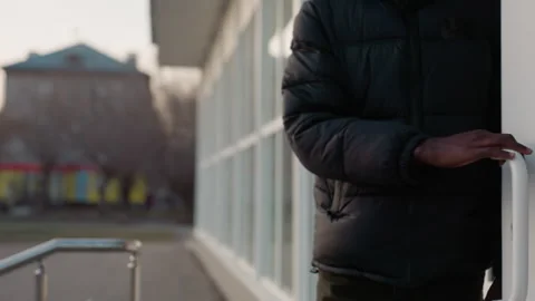 Close Up of Hand Pulling Glass Door Handle to Exit Building Stock Footage 318704908