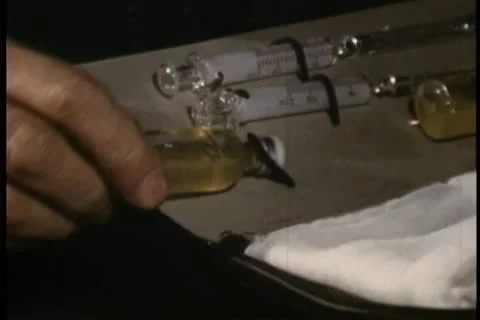 Close-up of hand pulling out bottle from medical kit Stock Footage 11354567