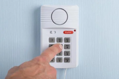 Close-up Of A Hand Pushing Button In Security System Foto stock
