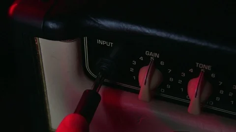 Close up of Hand put In and Out Aux Cable from Amplifier Vídeo Stock 123858309