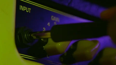 Close up of Hand Put In and Take Out Aux from Amplifier Vídeos de archivo 124086610