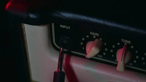 Close up of Hand Put in Aux and turning Up Gain Button of Amplifier Vídeos de archivo 124086572