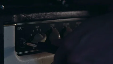 Close up of Hand Put in Aux Cable and Turn on Amplifier Stock Footage 124086399